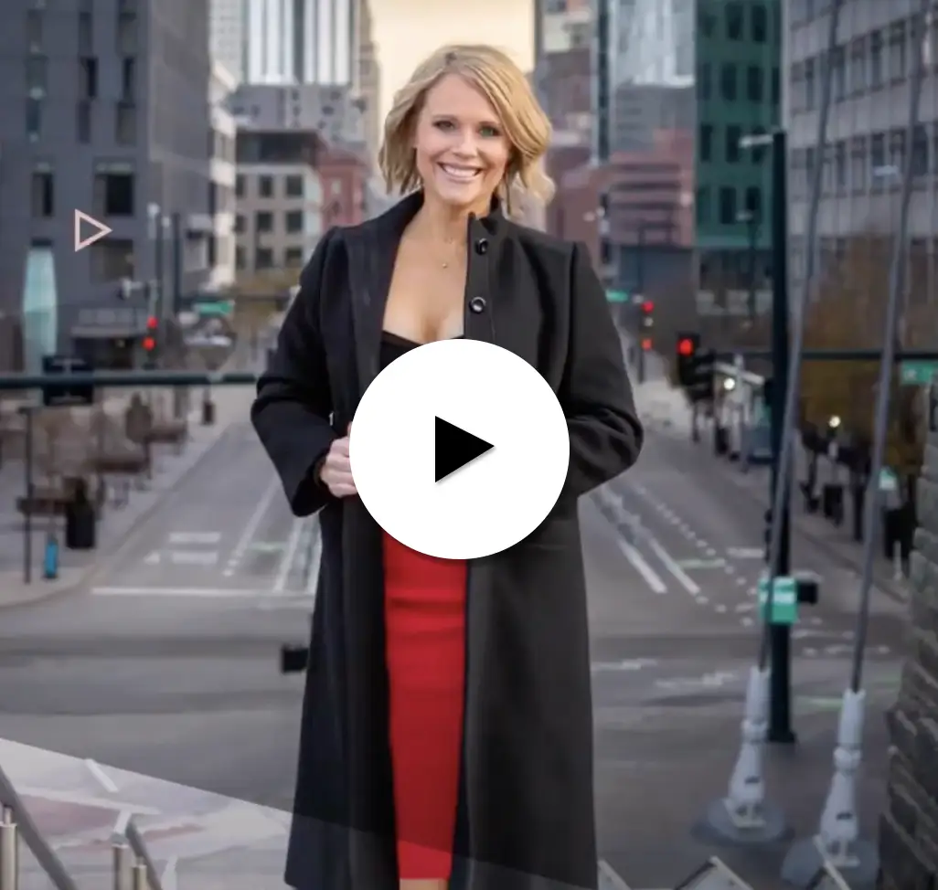 image of a real estate agent with a video play button.